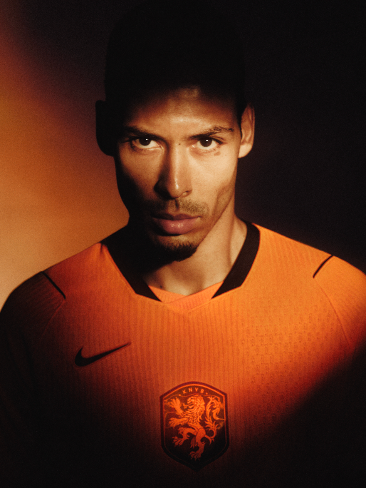 Netherlands football player in orange Nike jersey